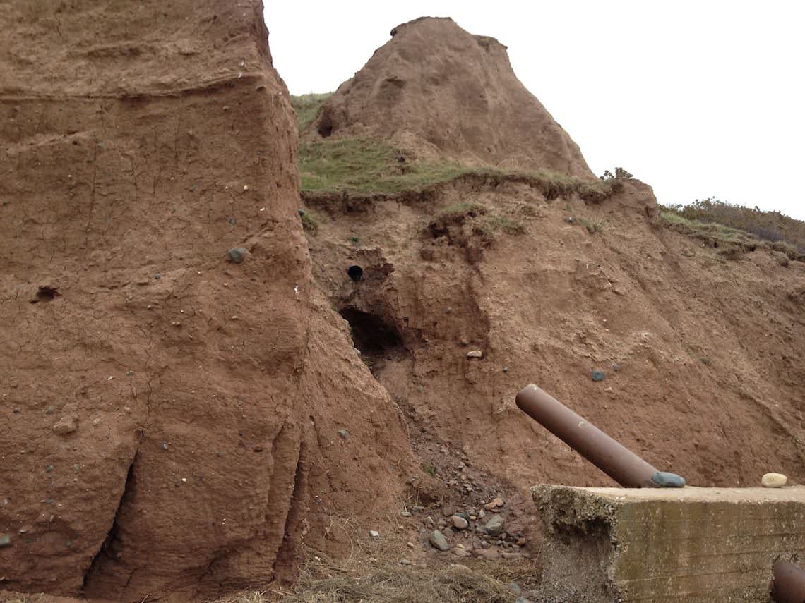 A drainage pip that has been unsuscesful in preventing cliff collapse.